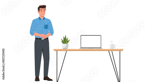 Professional man standing beside desk with laptop.