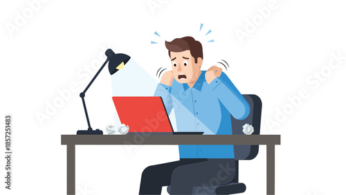 Stressed man at desk with laptop holding head.