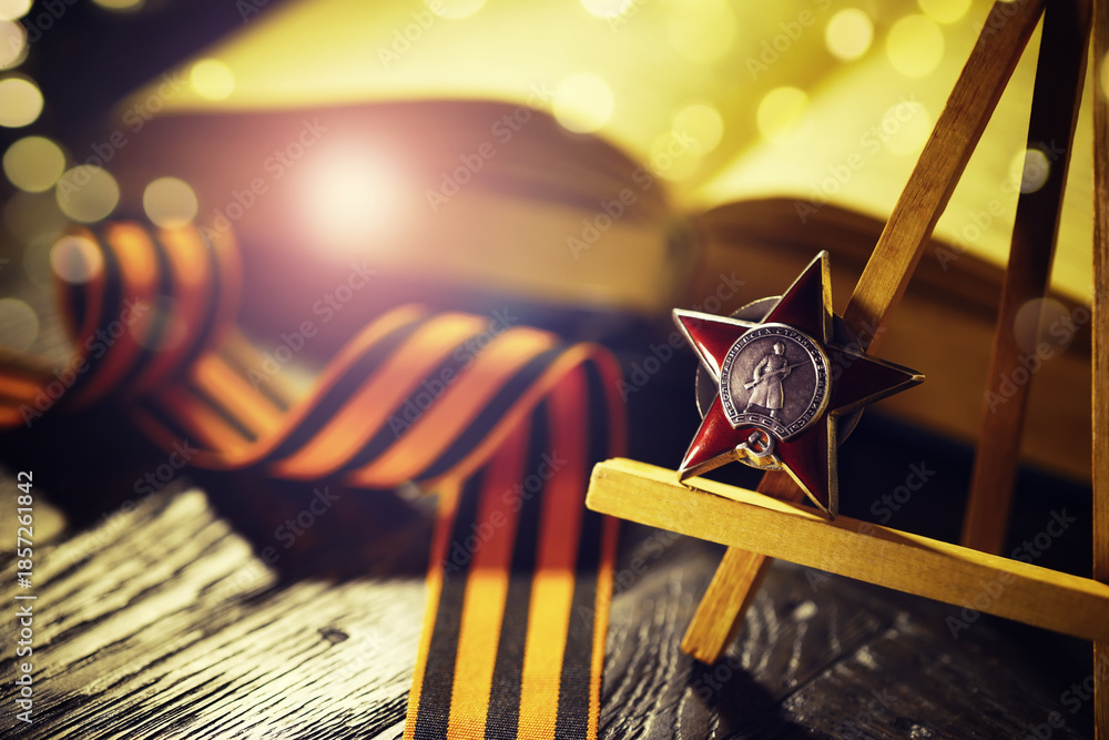 Fototapeta premium The Soviet order of the Second World war, Victory Day 9 May postcard concept, toned vintage