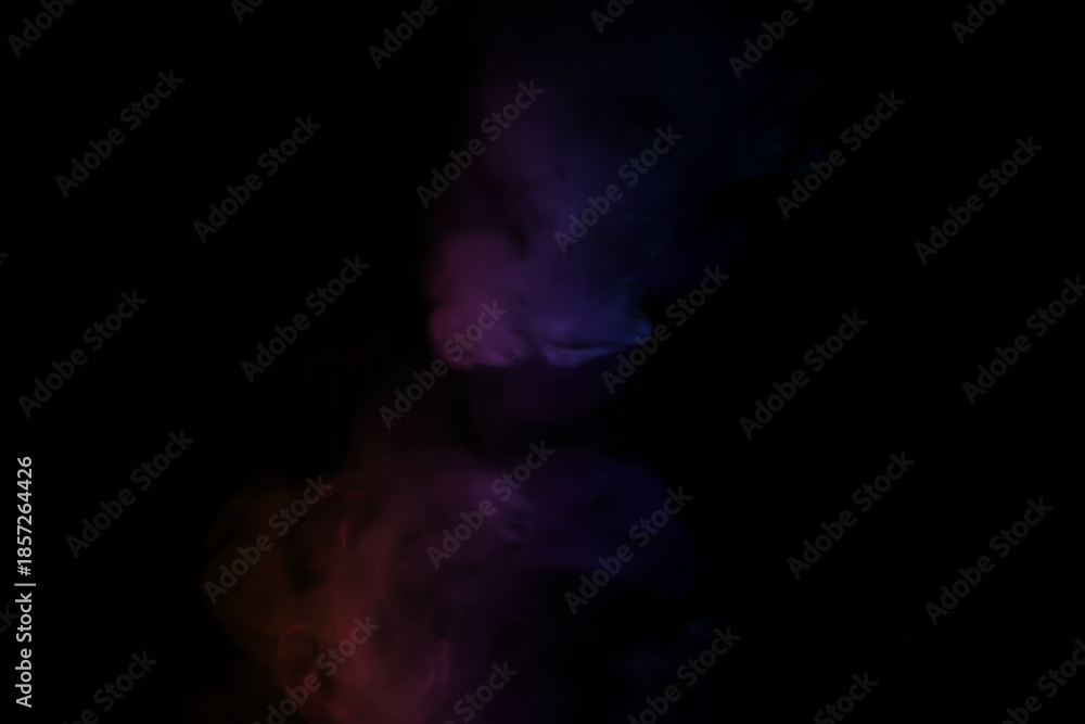 Fototapeta premium colorful smoke on dark background. Color steam on a black background. Red and blue smoke. Copy space.