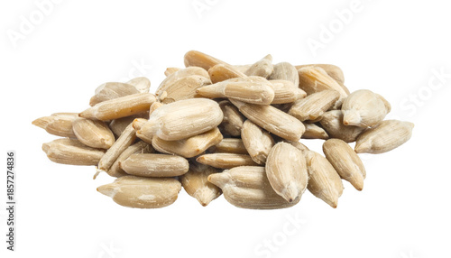 A close-up shot of a pile of hulled, light-colored seeds, likely from a flower, scattered against a black background