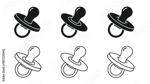 A collection of black and white baby pacifiers in various orientations