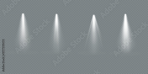 Four bright spotlights shine on a dark stage. Spotlights create dramatic lighting. Each spotlight casts a focused beam. Spotlights illuminate the stage.