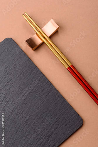 A black slate stone board or plate, an empty kitchen utensil. A black slate board