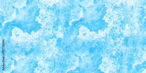 Abstract light blue grunge paint wall texture background, resembling frosty ice or watercolor marble. frosted, icy appearance with scattered speckled details and smooth blended tones. scratch wall.