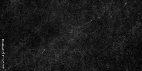 Dark grunge texture with deep black and charcoal tones, featuring rough, cracked surfaces and subtle scratches. cement concrete wall and ceramic tiles background. gray dirty stan, rusty metal texture.
