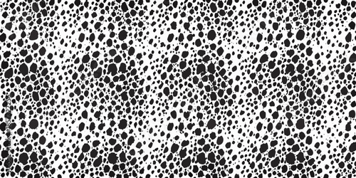 A dense abstract pattern of irregular black shapes on a white background