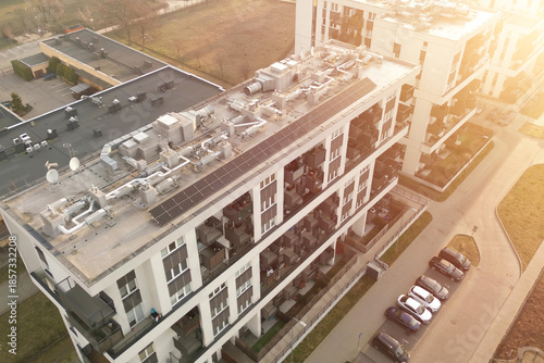 фотографія Modern city building rooftop solar energy system