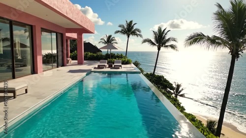 Wallpaper Mural Luxury villa with infinity pool overlooking the ocean on a sunny day. Torontodigital.ca