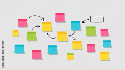 Colorful Sticky Note Brainstorming Concept With Arrows And Planning On White Wall.