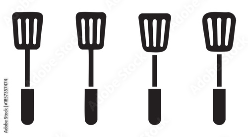 Four black kitchen spatulas are lined up horizontally, showcasing essential cooking tools for various culinary tasks and food preparation.
