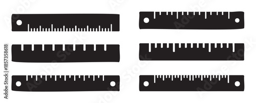 Six black rulers with various measurement markings and holes, representing different scales and designs for precision and accuracy in various fields.