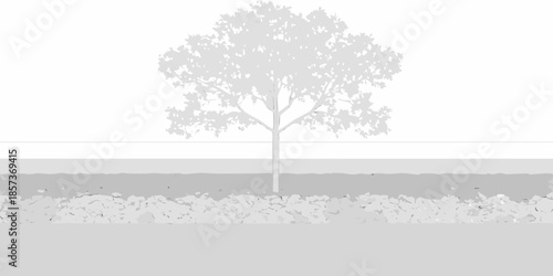 A solitary tree silhouette against a gray landscape and horizon line