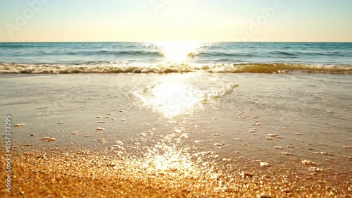 Shimmering Shoreline Waves beach sparkle summer Low angle shot, capturing small, gentle waves as they wash ashore and recede,