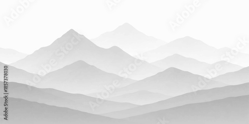 Snowy mountain landscape with hills valleys and misty peaks