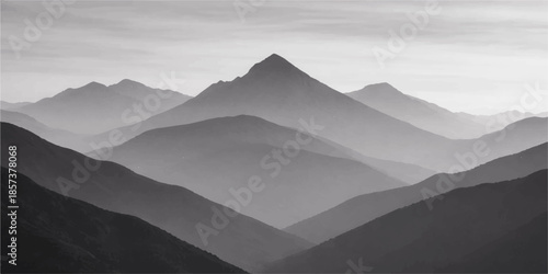 Morning mountain landscape with misty peaks and valleys