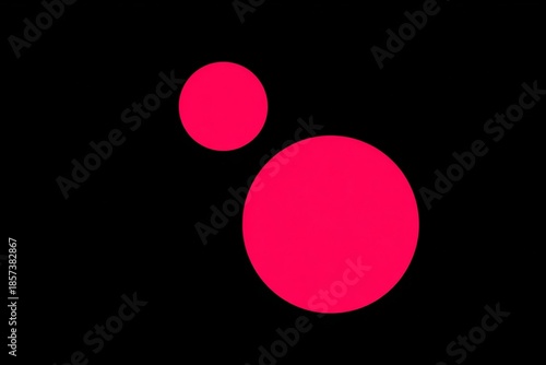 Bold pink circles on black background