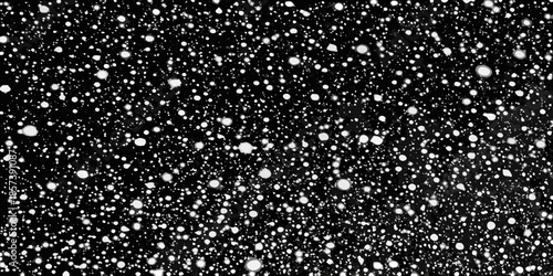 A black background with scattered varying sizes of white circular shapes