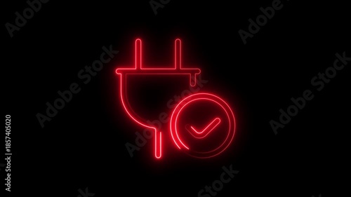 A neon sign of a toilet with a plug in a dark background, captured in a video