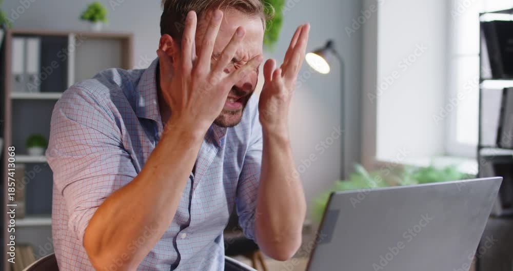 Man laptop stress frustration online work anger failure. At desk he ...