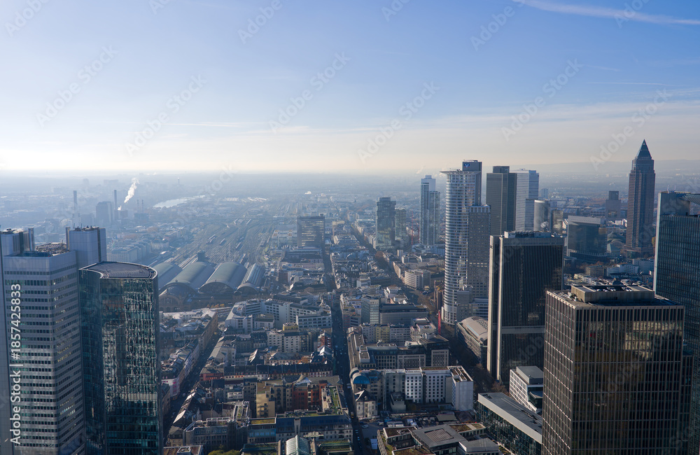 Obraz premium Aerial view from viewing platform of Main Tower platform with skyline and blue sky background on a sunny autumn day. Photo taken November 22nd, 2025, Frankfurt am Main, Germany.