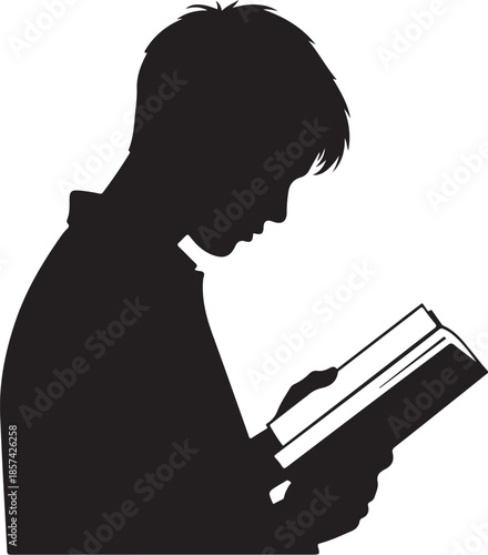 Silhouette of a boy reading a book intently