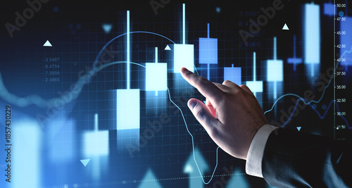 Cuadro en lienzo Businessman hand interacting with digital forex candlestick chart on futuristic blue interface background representing investment and market analysis concept