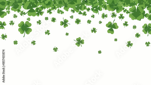 A cascade of green shamrocks and four-leaf clovers falling against a white background, evoking luck and St. Patrick's Day.