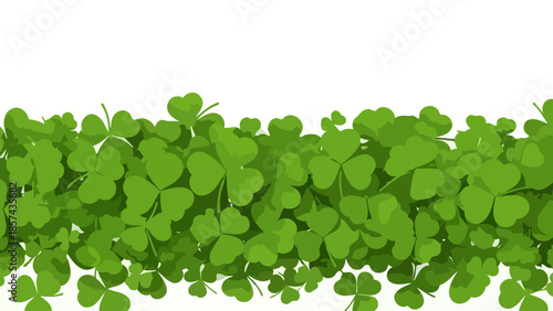 A horizontal border of lush green shamrocks and clover leaves against a white background.