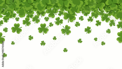 A cascade of green shamrocks falling against a white background, symbolizing luck and St. Patrick's Day.