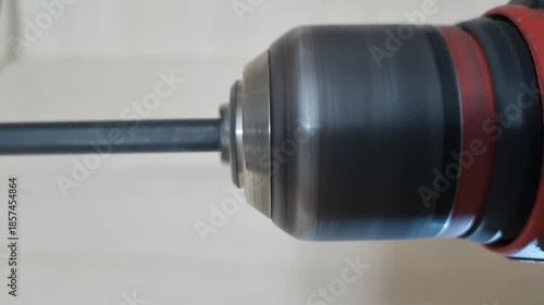 Close up action shot of a cordless drill motor running with a bit spinning fast ready for drilling work