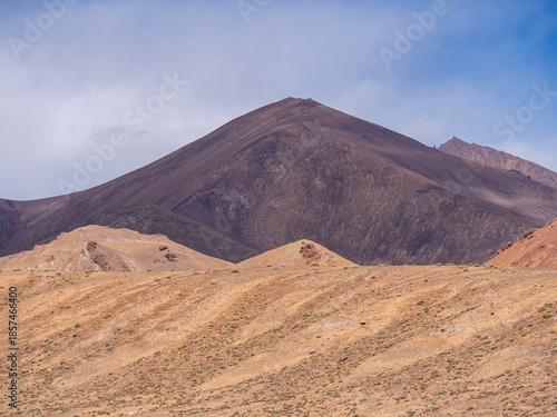 High altitude landscape view of colorful orange and purple mountains, Murghab, Gorno-Badakhshan, Tajikistan Pamir
