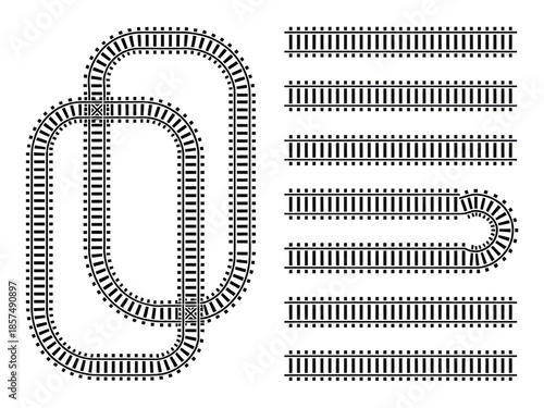 An assortment of model train tracks, including curves and straight sections.