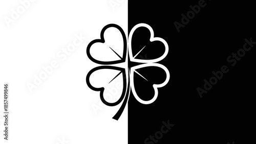 A striking black and white graphic design featuring a four-leaf clover divided by a vertical line, symbolizing balance and duality.