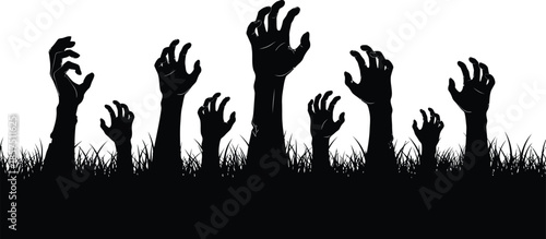 Eerie zombie hands rising from grassy ground in darkness