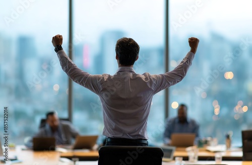 Business Professional Celebrating Success in Office, Ideal for business success visuals, corporate morale content, career achievement ads, team celebration materials, or workplace motivation designs