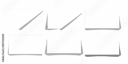 Arrangement of white boxes with cast shadows on a plain background