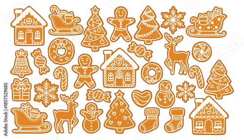 Large collection of holiday biscuits. Assortment of glazed gingerbread houses, trees, men, sleighs, deer and snowflakes for festive design.
