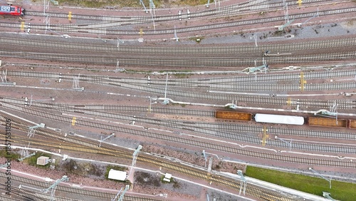 Aerial View of Halle Freight Railway Yard with Multiple Tracks and Cargo Trains