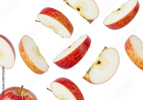 Multiple crisp red apple slices with vibrant red and yellow marbled skin and transparent flesh, suspended dynamically against a transparent background with copy space, concept for healthy eating
