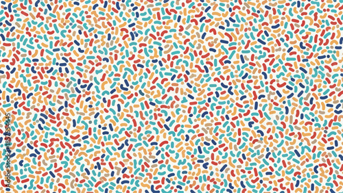 Vibrant multicolored confetti scattered everywhere on a bright surface, creating a lively celebration atmosphere.