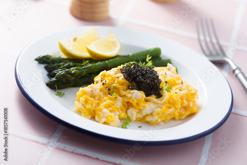 Scrambled eggs with asparagus and caviar