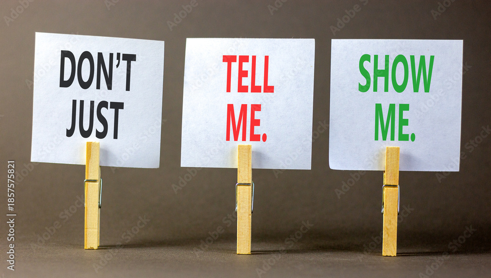 Fototapeta premium Tell or show symbol. Concept words Do not just tell me, show me on beautiful white papers on wooden clothespins. Beautiful grey background. Business tell or show concept. Copy space.