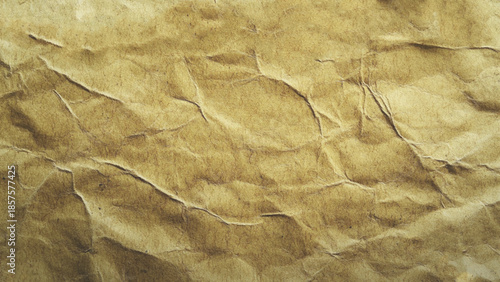 Craft crumpled paper, cardboard background. Brown kraft sheet texture, torn antique page, wallpaper or parchment abstract design, Horizontal rough carton