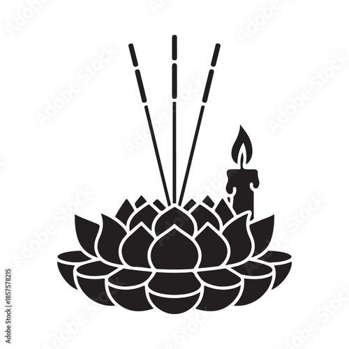 A black silhouette of a lotus flower candle and incense sticks