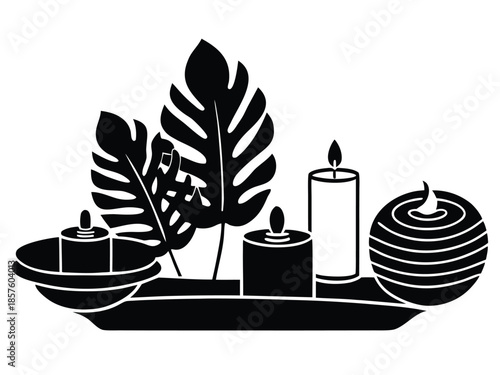 Serene spa centerpiece with candles and leaves