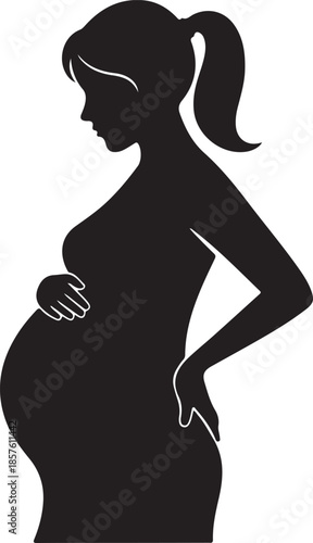 Silhouette of a pregnant woman in profile gently cradling her baby bump