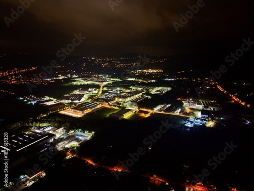 Illuminated Power Site At Night, Dark Landscape Illuminated By Extensive Energy Facility Lights