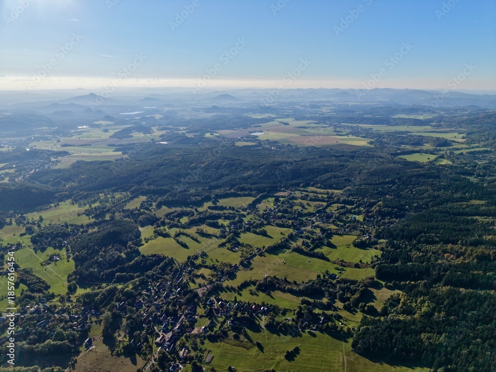 Fototapeta premium Highaltitude Rural Landscape, Aerial Perspective Showcasing Patchwork Fields And Rural Hamlets