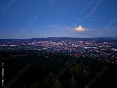 Elevated Perspective Of Illuminated City With Expansive Streets And Vibrant Neighborhood Lights